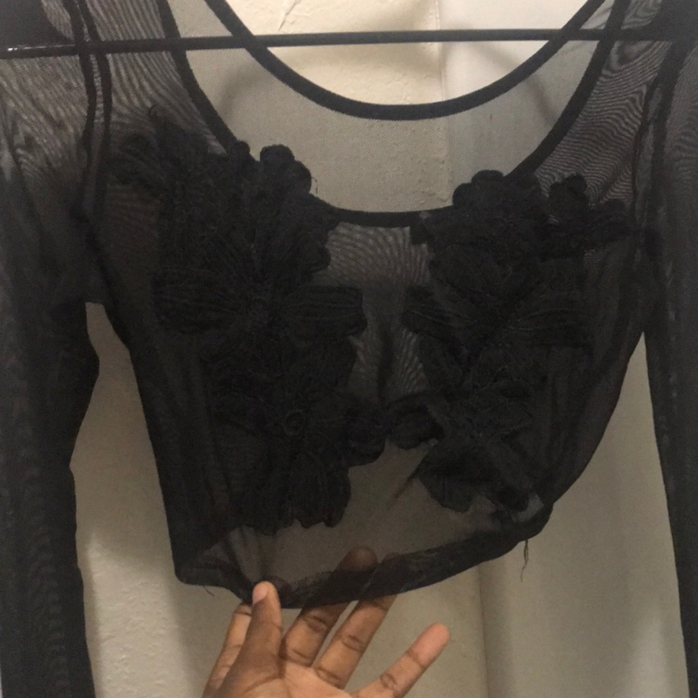 Black sheer crop top with floral design on front